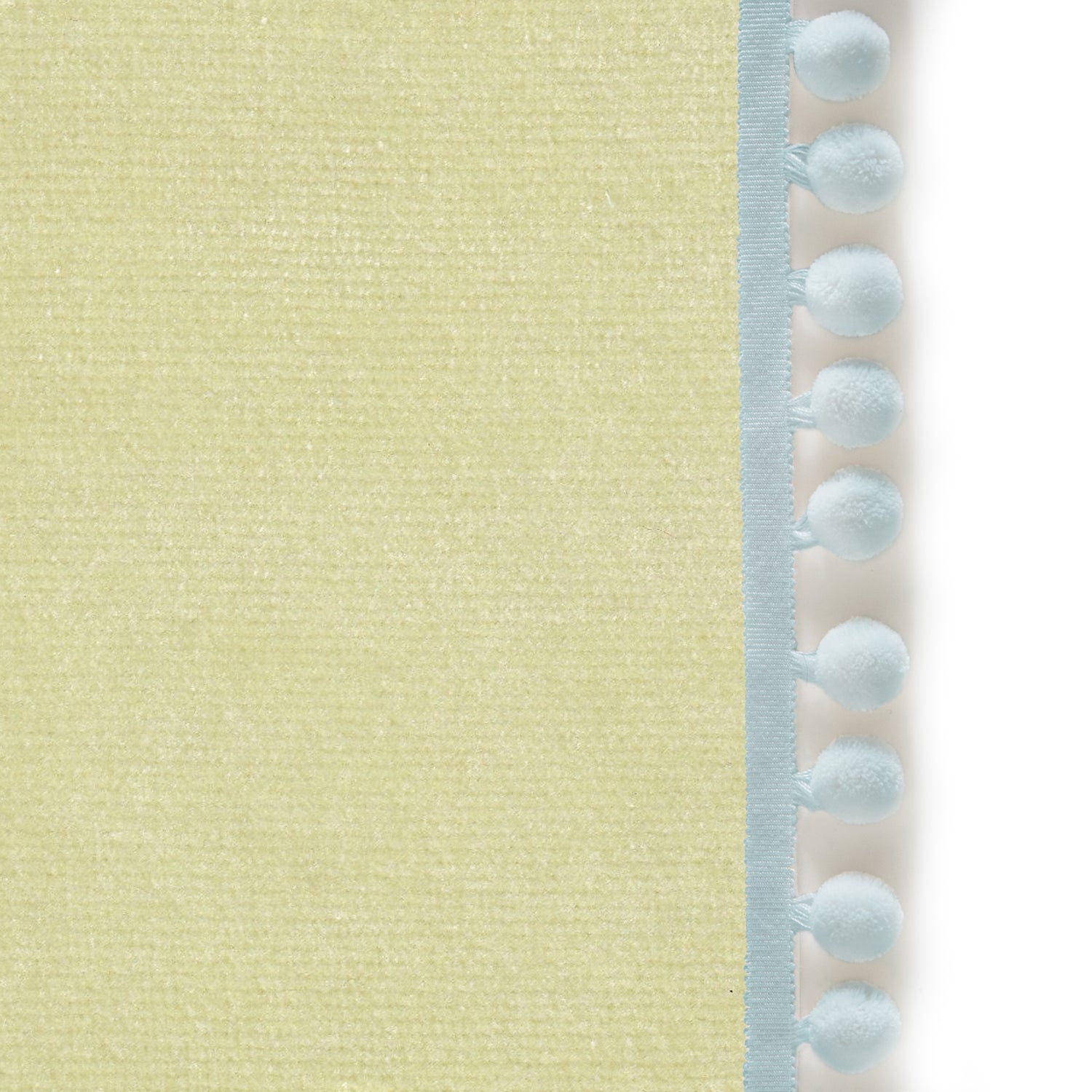 Upclose picture of Pear Velvet custom curtain with powder pom pom trim