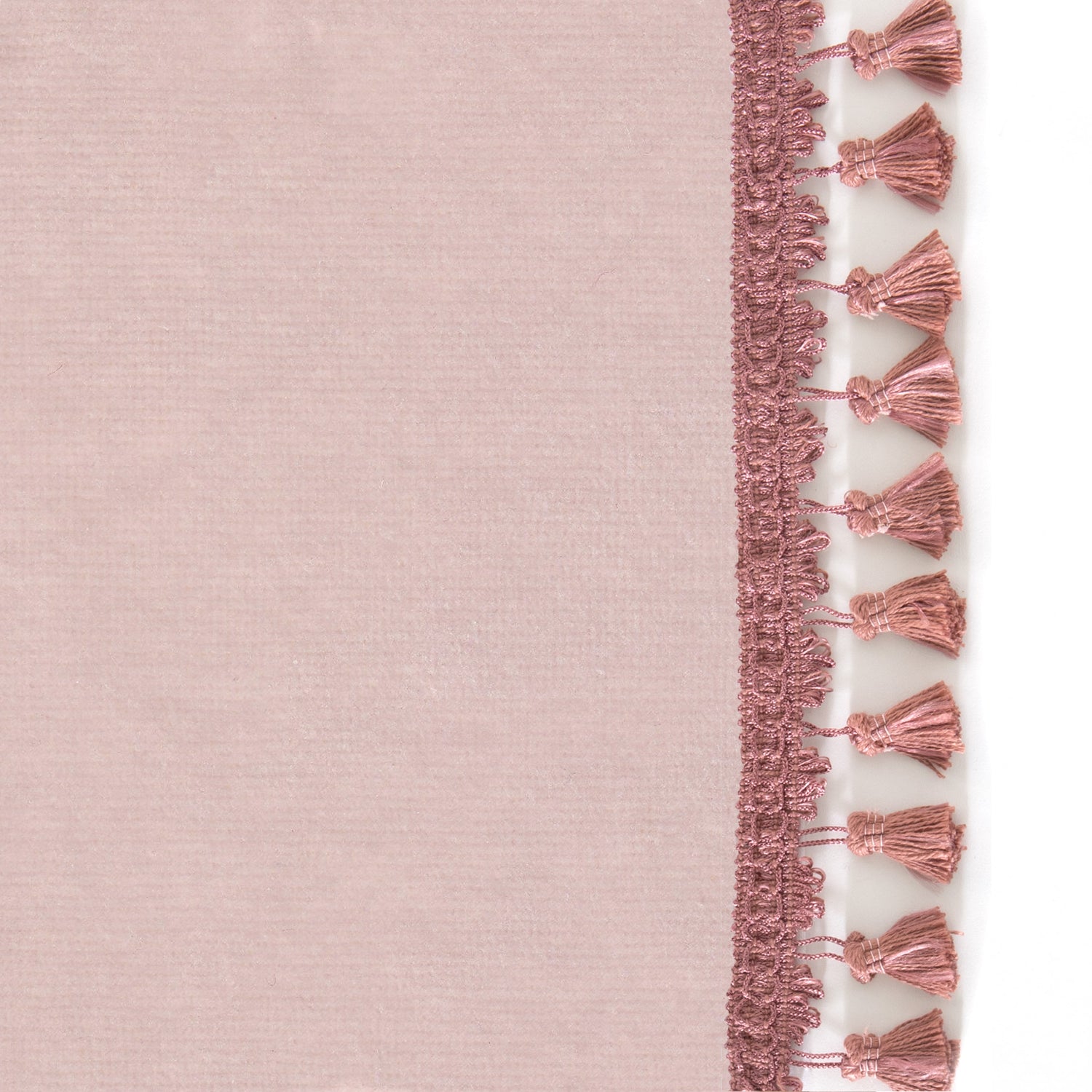 Upclose picture of Rose Velvet custom curtain with dusty rose tassel trim