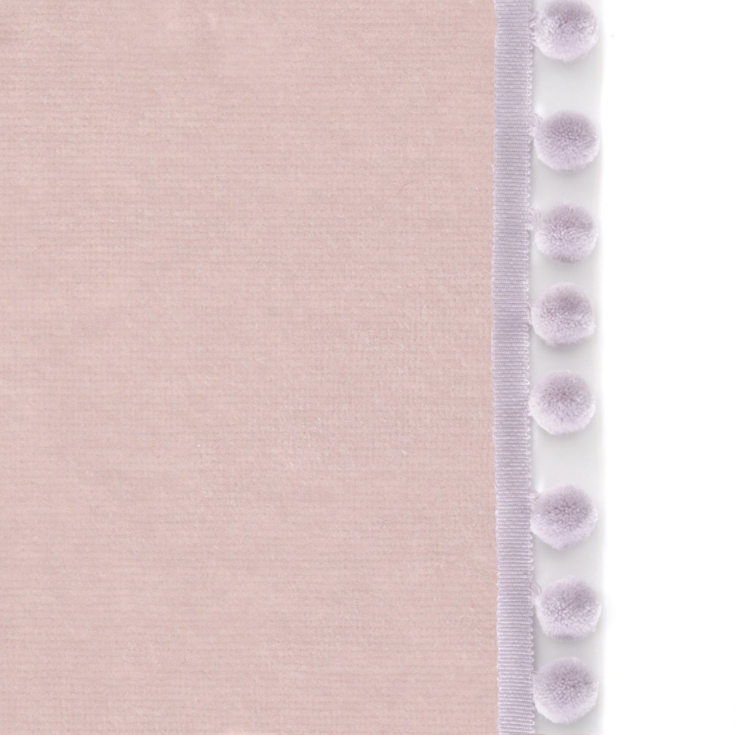 Upclose picture of Rose Velvet custom curtain with lilac pom pom trim