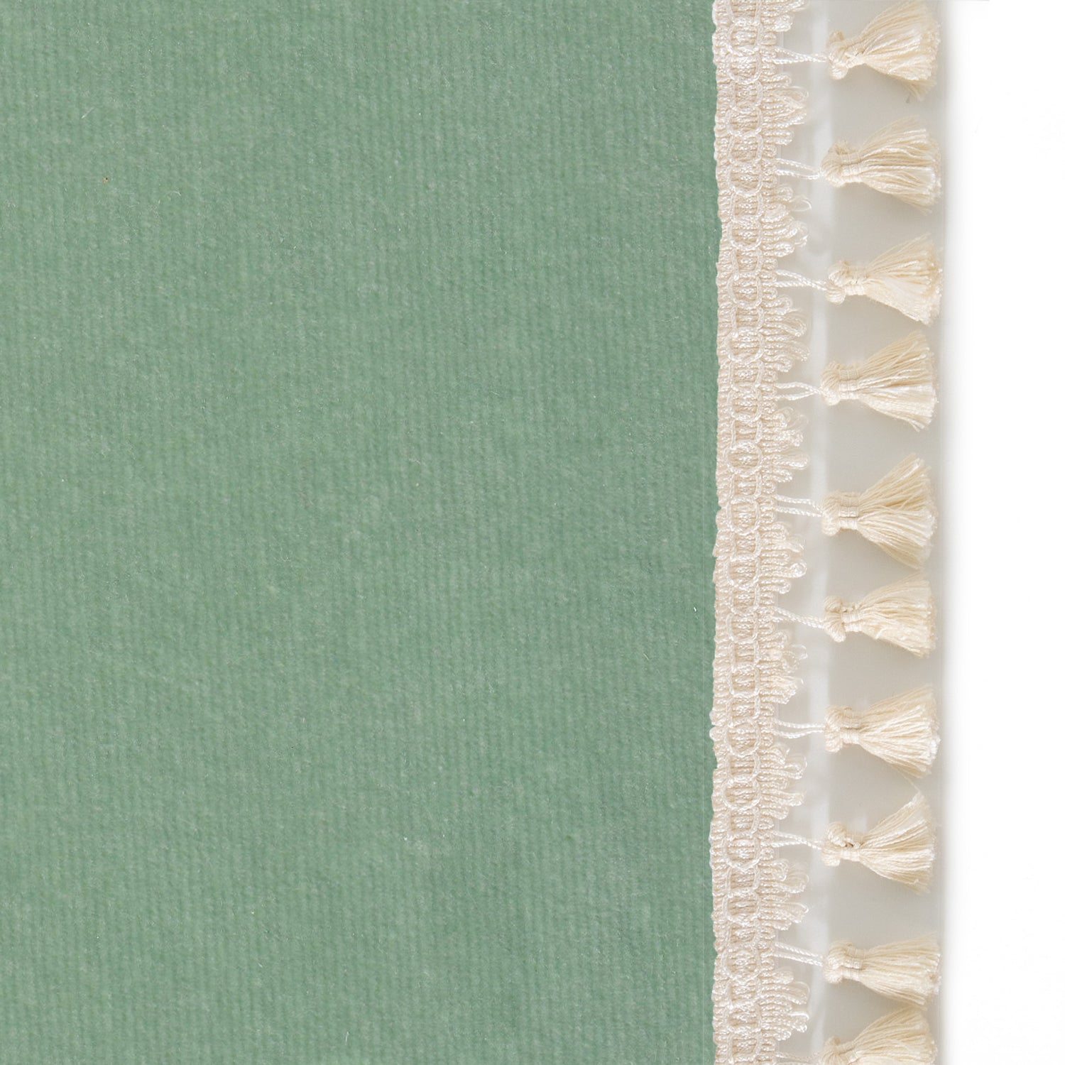 Upclose picture of Sea Salt Velvet custom Blue Greencurtain with cream tassel trim