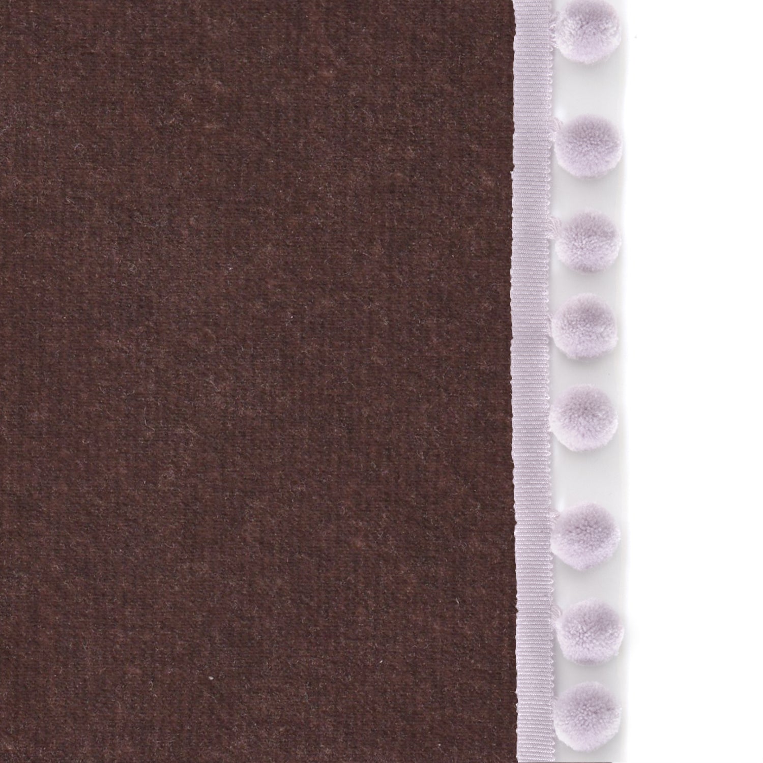 Upclose picture of Walnut Velvet custom Browncurtain with lilac pom pom trim