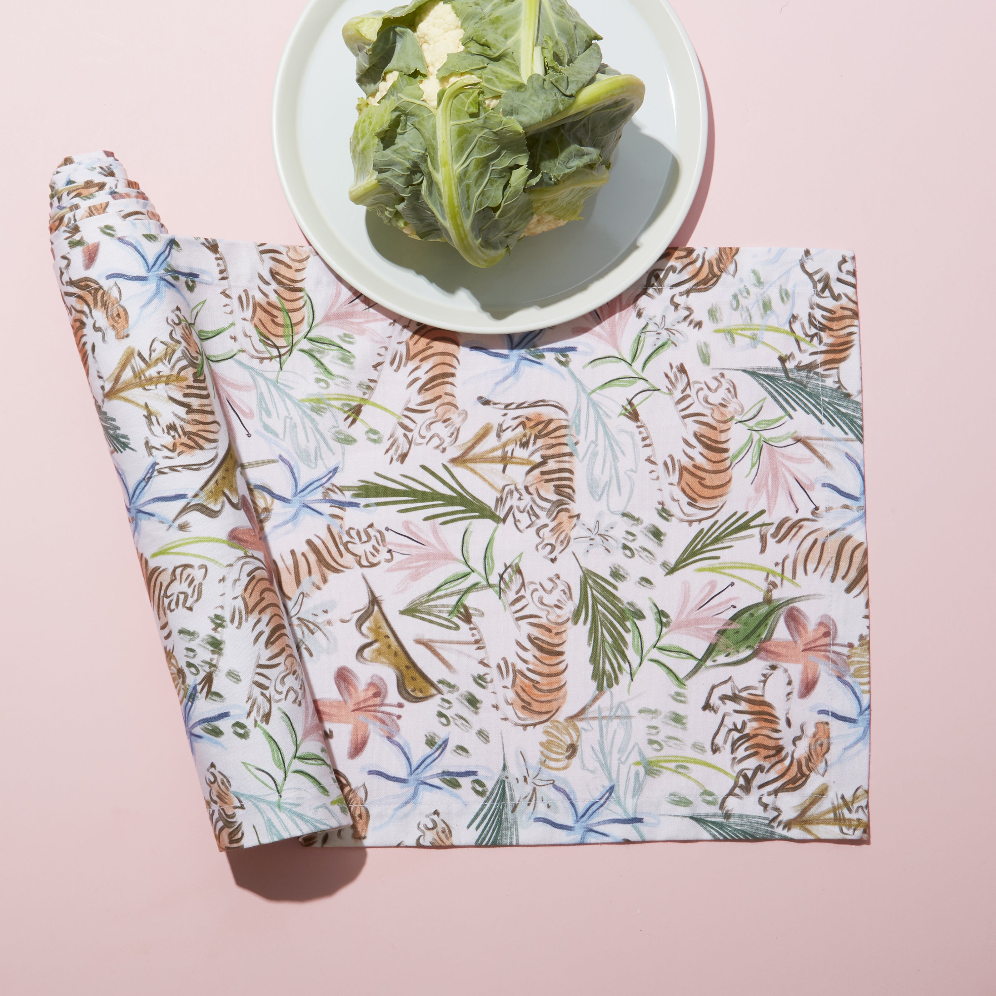 Rolled Pink Chinoiserie Tiger Printed Table Runner with lettuce on white plate