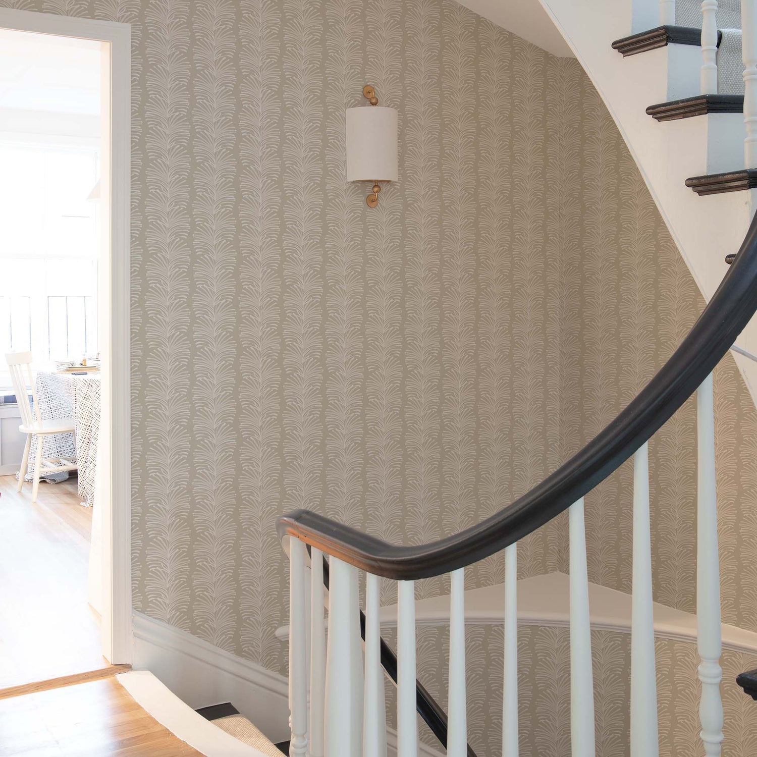 Staircase with Beige Botanical Stripe Wallpaper and white and gold lamp 