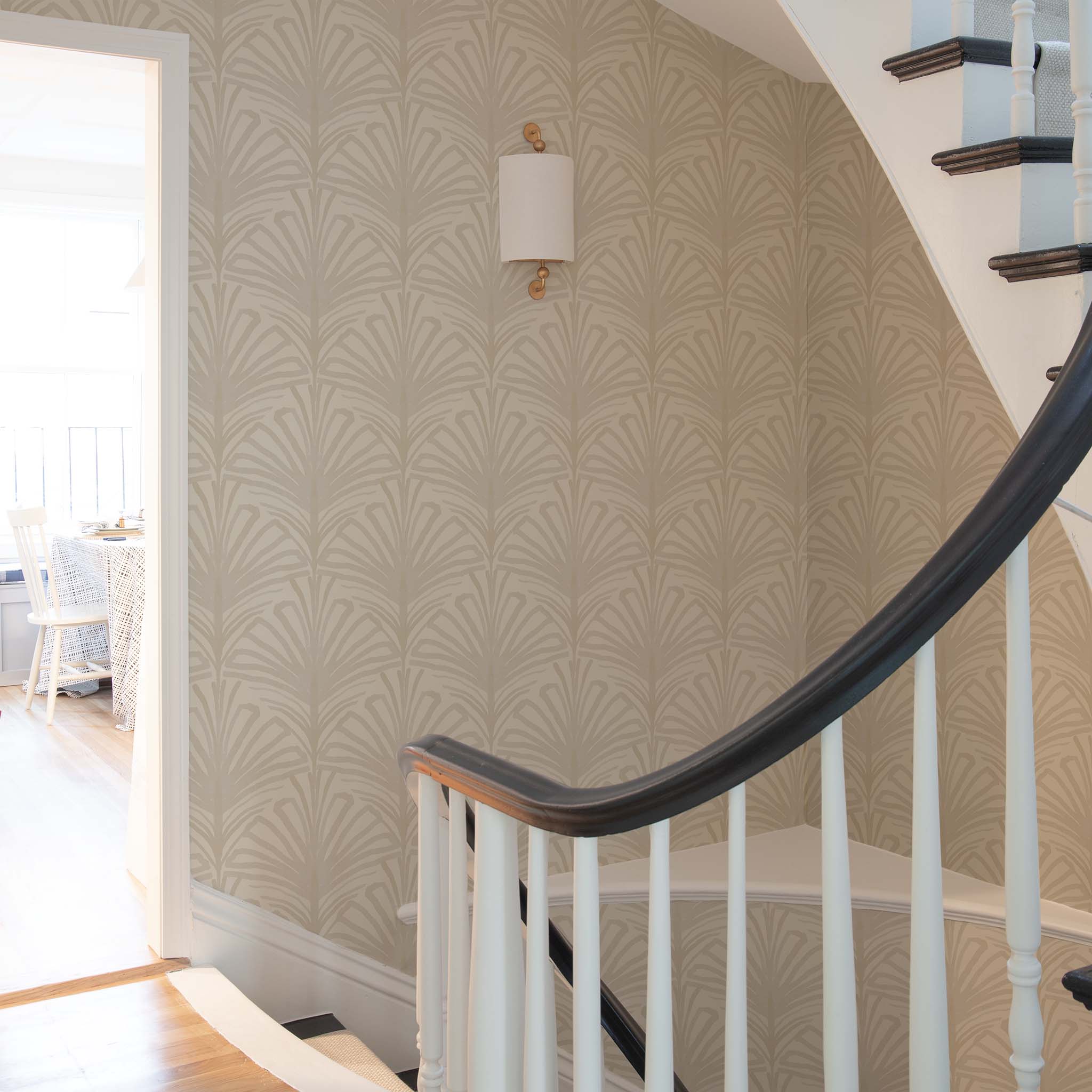 Staircase styled with beige palm printed wallpaper