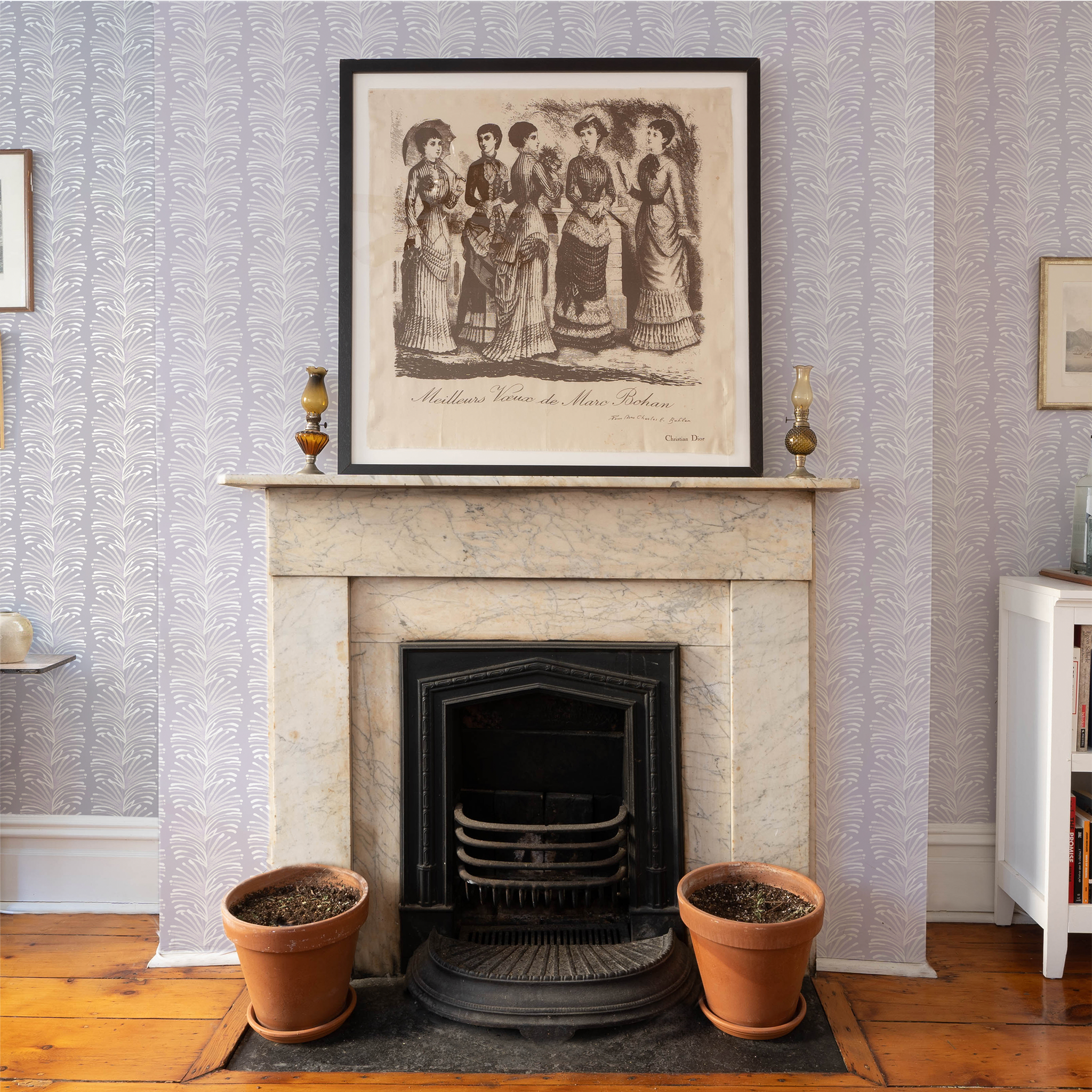 Fireplace on living room styled with Lavender Botanical Stripe Printed Wallpaper with brown and cream painting of women