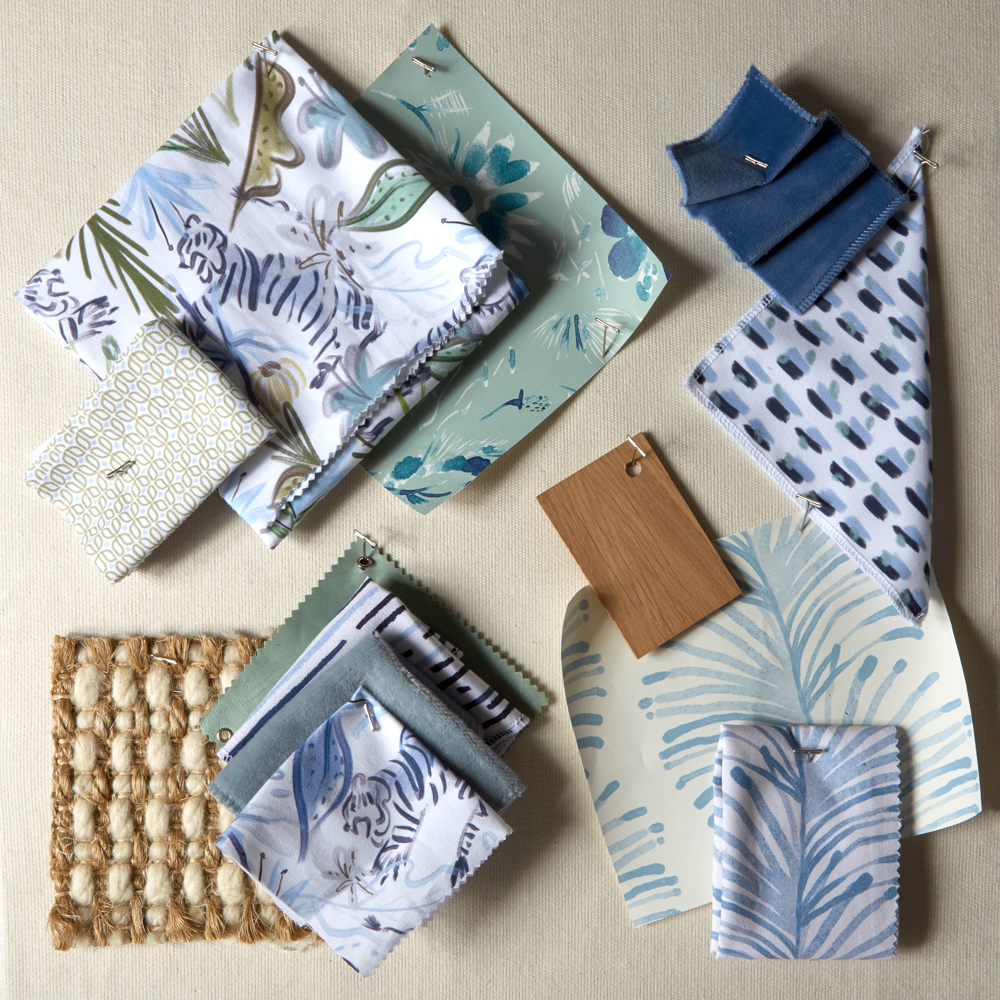 Interior design moodboard and fabric inspirations with Blue Chinoiserie Tiger Printed Swatch, Sky Blue Printed Swatch, Moss Green Geometric Printed Swatch, Sky Blue Botanical Stripe Printed Swatch, and navy velvet swatch